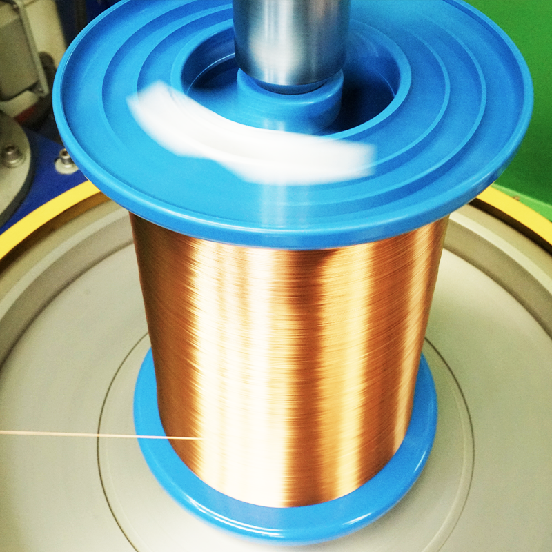Solderable polyurethane enameled round copper wire on a spool for coil winding